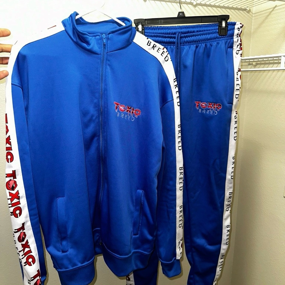 Blue Track Suit with Red and White Accents
